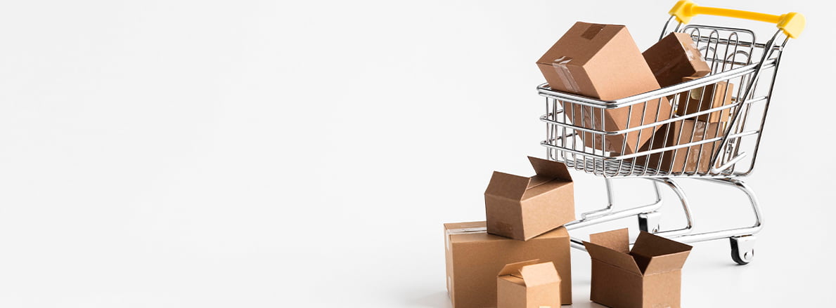 A shopping cart with boxed items in it, ready to checkout.